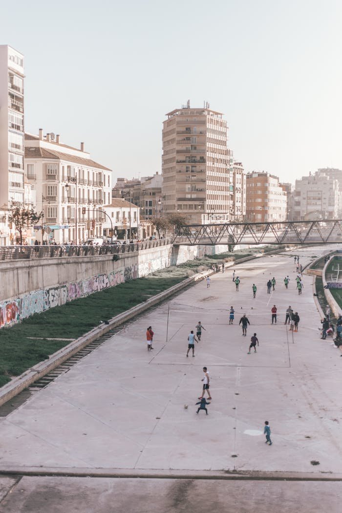 People enjoying leisure activities in a cityscape of Malaga, Spain.
